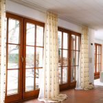 elegant modern living room curtains design beige patterned vertical curtains white long metal rod white colored sofas orange leather chairs living room vertical curtains interior comely design ideas 1